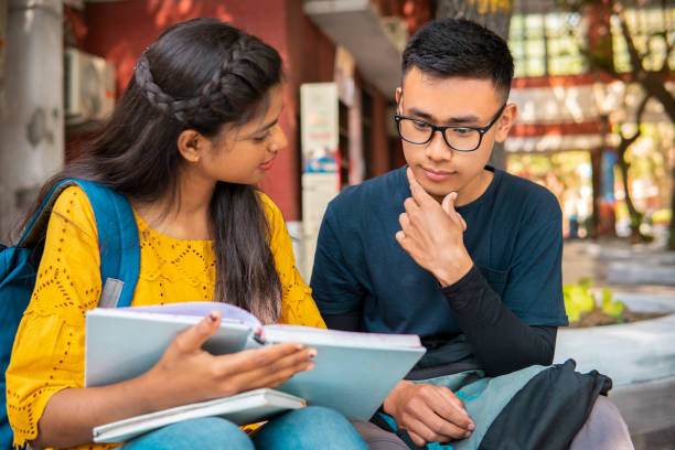 istock Multiethnic college student friends studying together at campus. 1416002619
