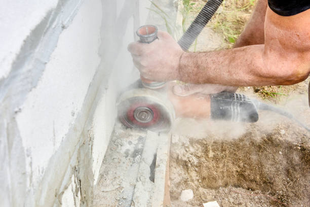 istock Cutting masonry with angle grinder power tool for cut concrete with silicon carbide wheels. 1416002790