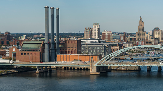 Distant Downtown view of Providence, Rhode Island. Dominion Energy Manchester Street Station at the front.