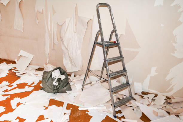 istock The stepladder stands near the wall with  torn wallpaper 1416004384