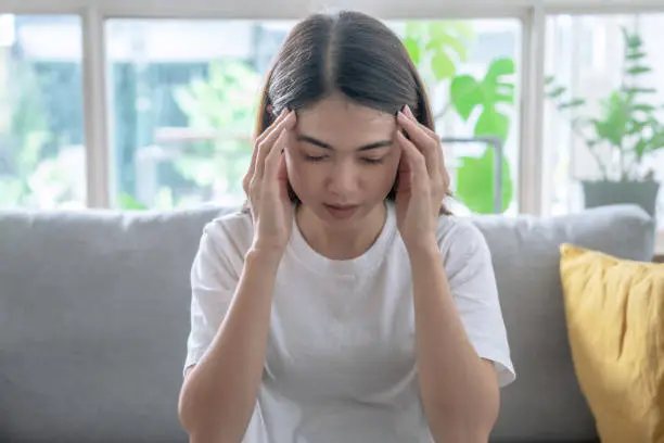 Photo of Asian woman have headaches and dizziness, Cerebrovascular disease, Migraine.