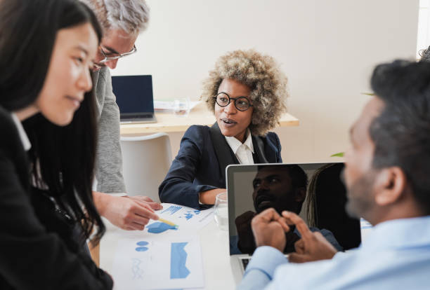 istock Multiethnic business people working inside modern coworking office 1416008929