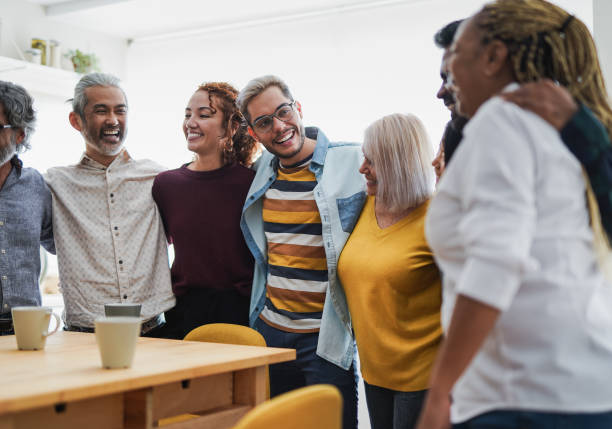 Multiethnic people having fun at home kitchen - Multi generational friendship concept