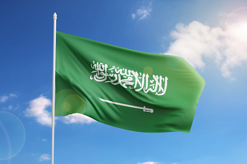 Flag of Saudi Arabia on blue sky. 3d illustration.