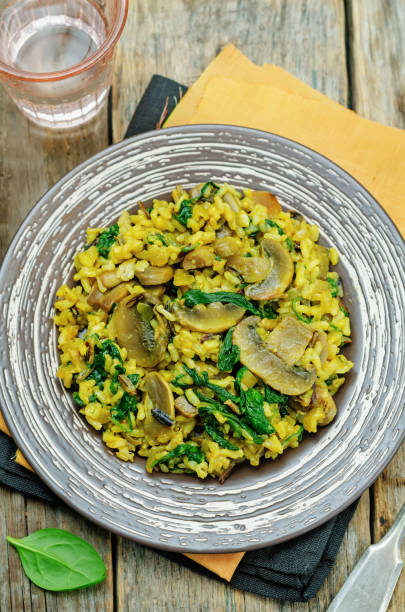 istock Mushrooms spinach turmeric brown rice in a plate 1416012417