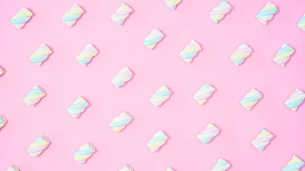 istock Creative colorful marshmallow pattern on pastel pink background. Flat lay 1416012537