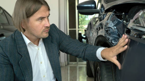 istock Inspecting Car Damage After An Crash In The Parking Lot 1416013178