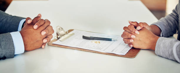 Couple hand sign legal divorce documents, contract or paper deal in a lawyer office with ring placed on table. Woman and man with signature on marriage paperwork after agreement at family law office la pareja firma a mano documentos legales de divorcio, contrato o acuerdo en papel en una oficina de abogados con anillo colocado sobre la mesa. mujer y hombre con firma en la documentación del matrimonio después de un acuerdo en la oficina de derecho de
