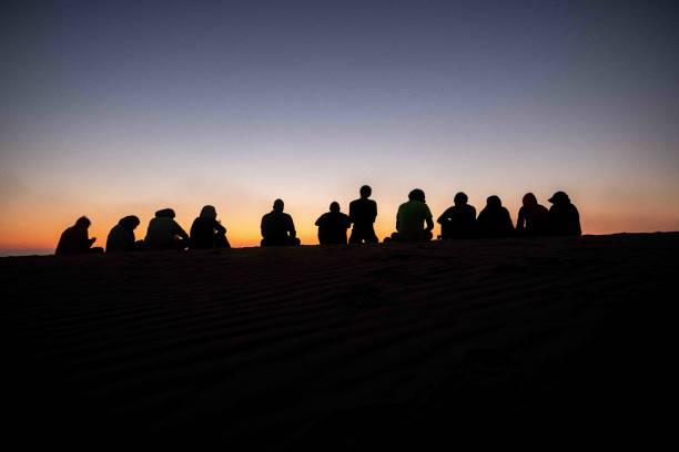istock group of people in silhouette 1416016309