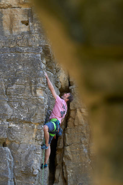 istock free climber in a difficult rock climbing tour 1416016541