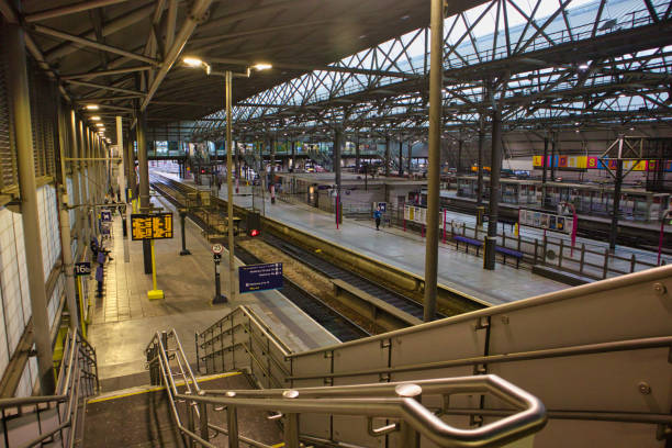 View of lime street station in the centre of Liverpool, UK.  People can be seen on the promenade.
