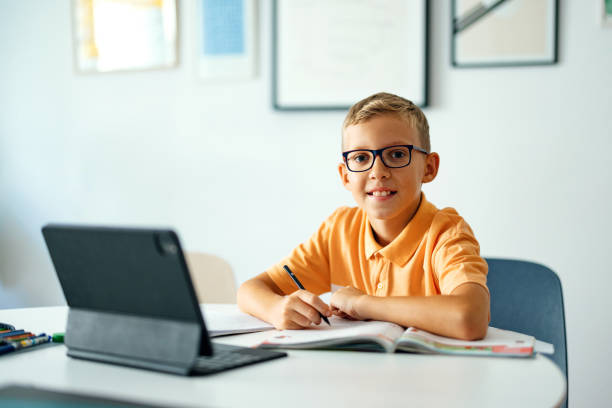 istock Portrait of a Young Boy Studying at Home 1416018489