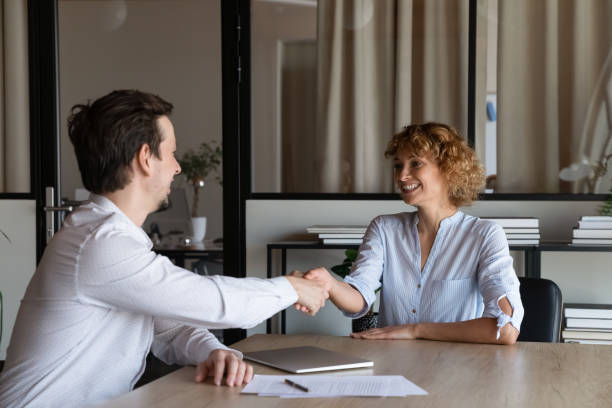 istock Happy diverse two business people shaking hands, making agreement. 1416018685