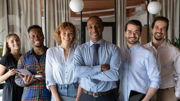 istock Team of happy professional financial advisors managers looking at camera. 1416019236