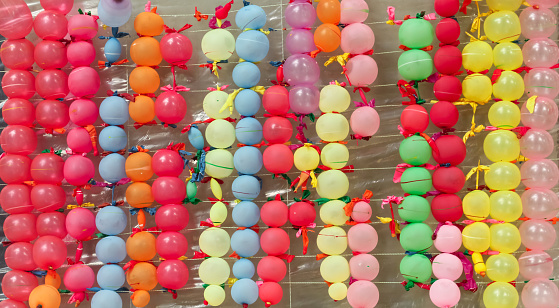 Colorful Large Soccer Balls Hanging As Gifts on Carnival.