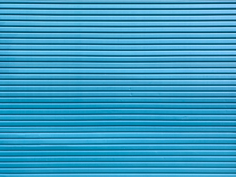 a blue steel loading dock roll up door shipping receiving corrugated metal garage