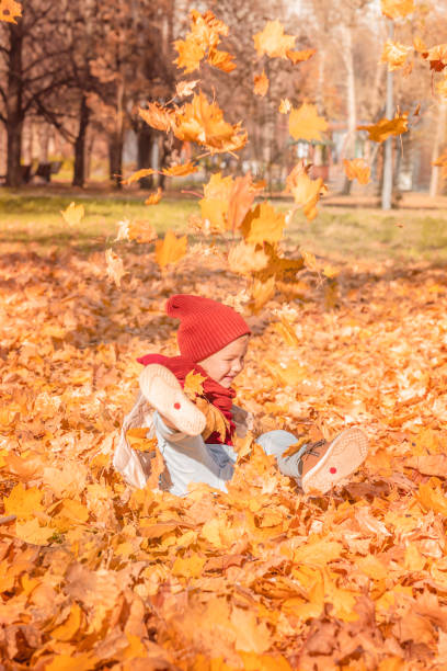 istock Happy child having fun in autumn park 1416026779