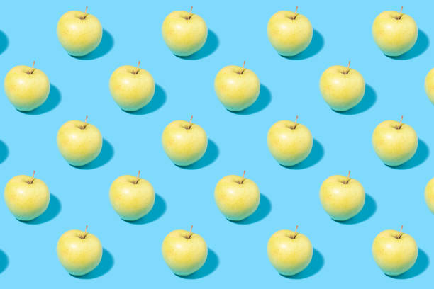 istock Summer fruit background - green apples on mint background 1416026795