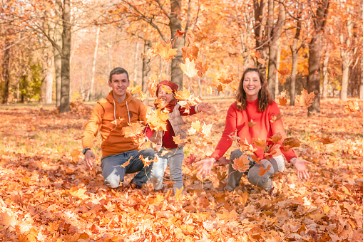 Happy family on autumn walk