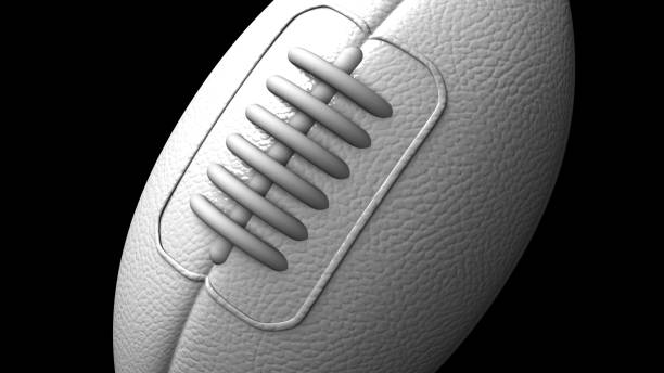 istock White rugby ball on black background. 1416027849