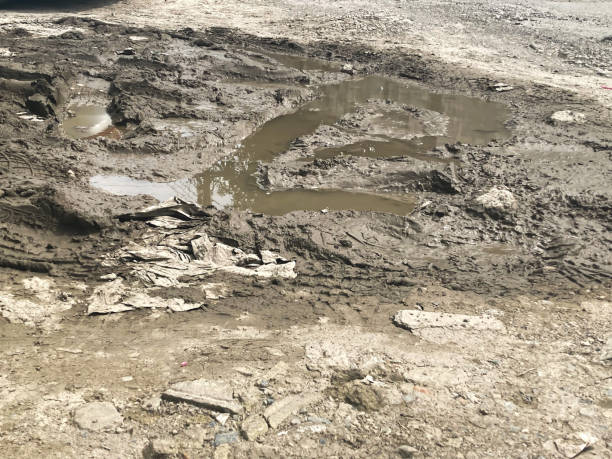 istock Muddy water on the road 1416028920