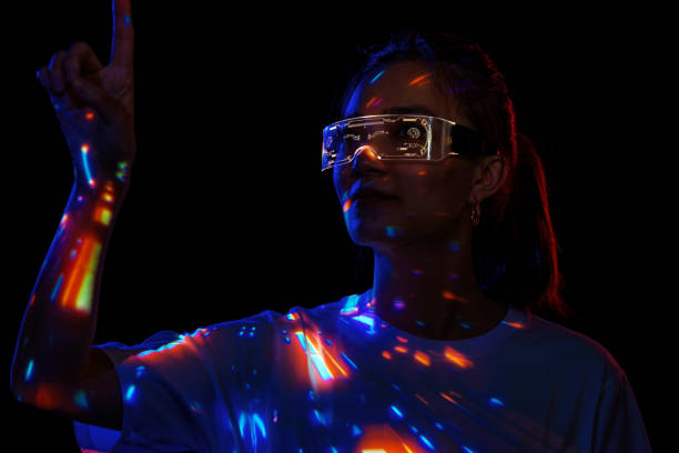 istock Metaverse VR virtual reality game playing, woman play metaverse virtual digital technology game control with VR goggle 1416029512