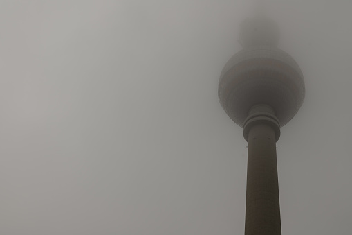 Berlin-Germany, January 16.2022: Partial view of the Berlin TV tower in thick fog