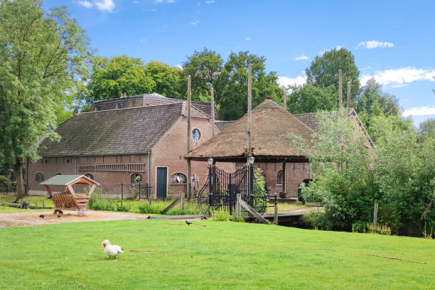 Voorburg, Netherlands - June 2022: Idyllic view of a Dutch farm and haystack on sunny summer day.