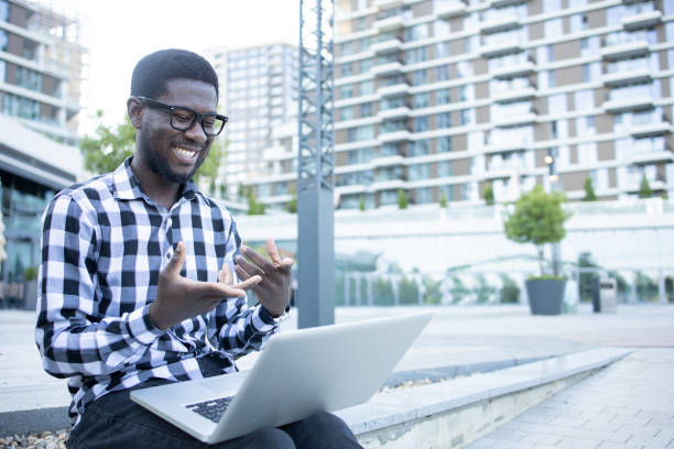 istock Young man is studying in the park 1416033287