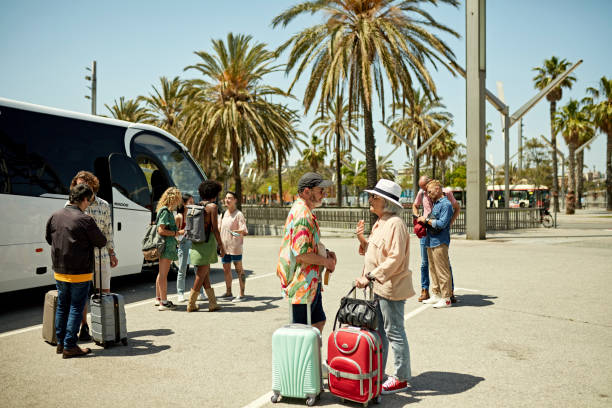 istock Vacationers waiting to board motor coach 1416033318