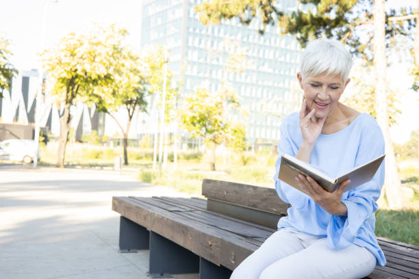 istock Senior woman studying in the park 1416033620