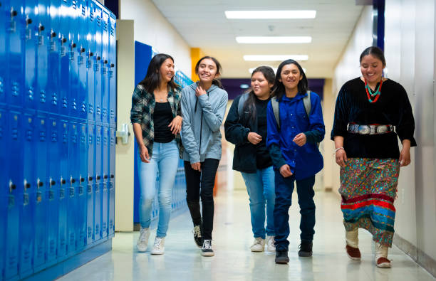 istock High schoolers walking on a corridor at school 1416036641