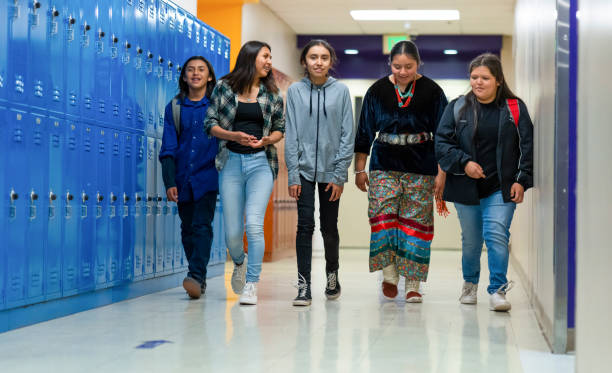 istock High schoolers walking on a corridor 1416036746