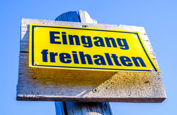 istock no parking sign in germany - translation: keep the exit clear 1416037019