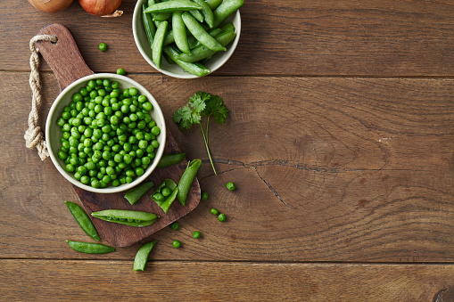 Fresh green pea vegetables with onion, food preparation