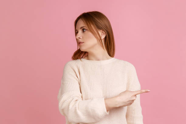 istock Woman showing exit, demanding to leave her alone, turning away with resentful irritated expression. 1416037846