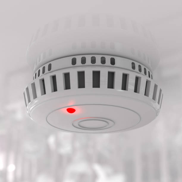 istock Smoke detector mounted on roof in apartment. 3d rendering 1416038228