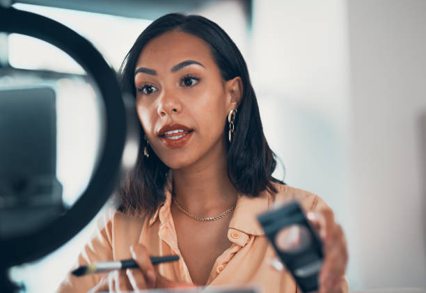 istock Beauty, vlogger and influencer doing makeup tutorial with digital tech. Livestream and conversation with social media followers about cosmetics. Trendy products and fashion blog for stylish women. 1416039253