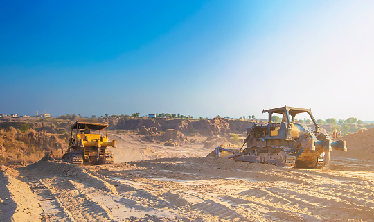 A bulldozer on work earthmoving, soil removing, earth working