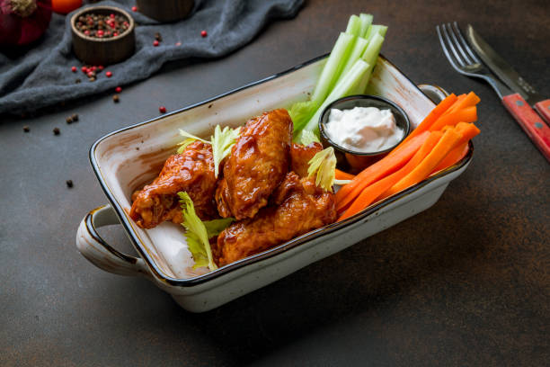 istock Chicken wings with blue cheese sauce, carrots and celery on plate 1416040455
