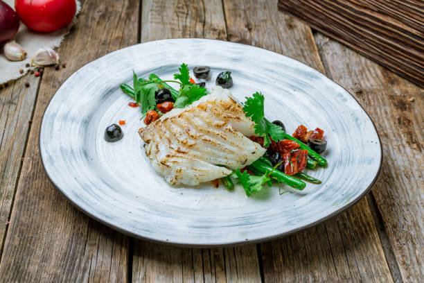 istock morue grill with green beans on plate on wooden table 1416040544