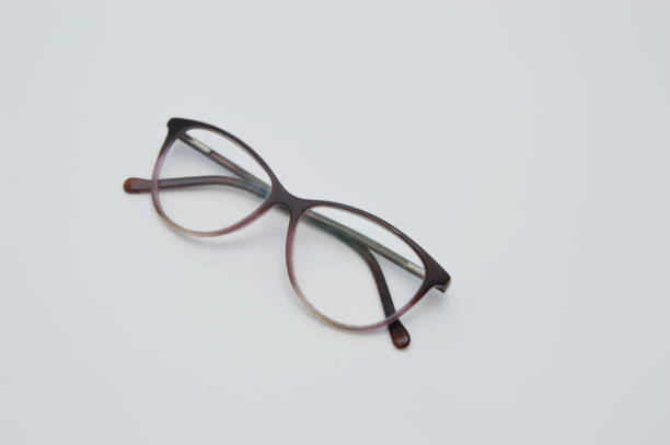 istock Glasses are transparent for reading or good vision, lie folded. on a light background. View from above 1416042318
