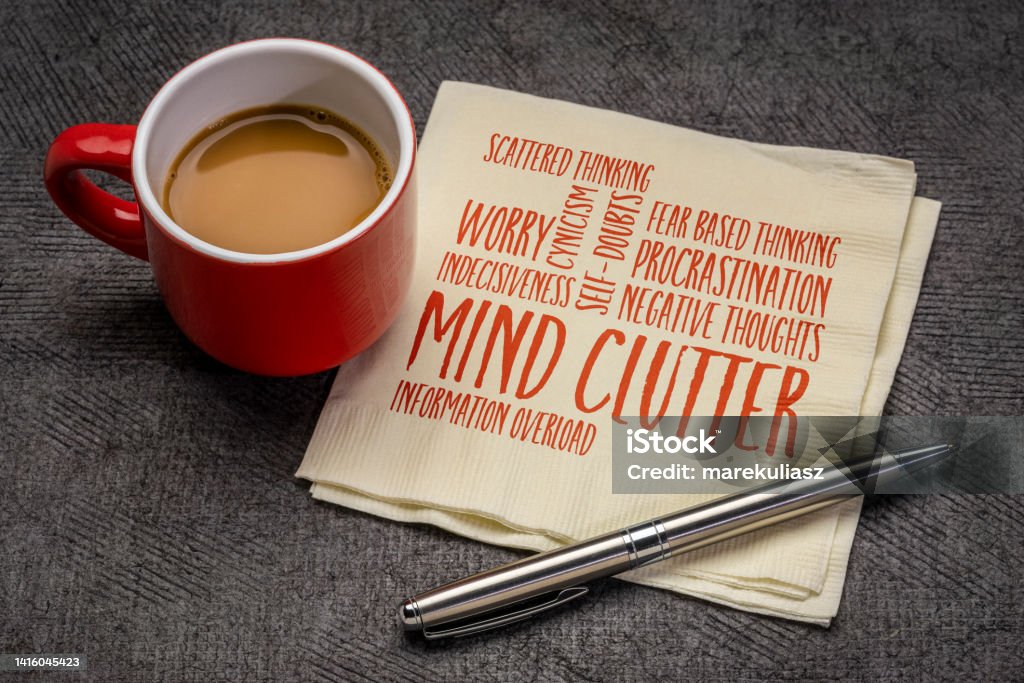 mind clutter word cloud on napkin mind clutter word cloud on napkin with a cup of coffee, mental health and personal development concept Contemplation Stock Photo