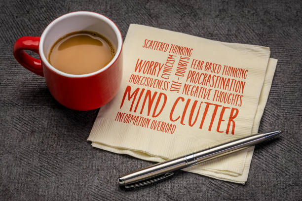mind clutter word cloud on napkin mind clutter word cloud on napkin with a cup of coffee, mental health and personal development concept cluttered stock pictures, royalty-free photos & images