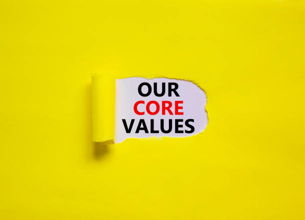 istock Our core values symbol. Words 'Our core values' appearing behind torn yellow paper. Beautiful yellow background. Business, our core values concept, copy space. 1416050536