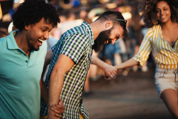 istock Young people dancing at a concert. 1416050588