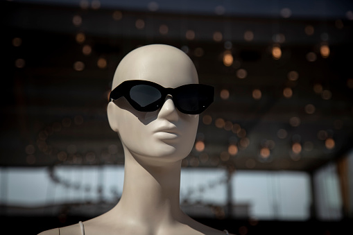 Mannequin Head wearing  sunglasses with lights behind