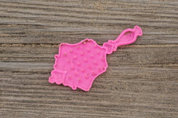 istock one small pink plastic toy hairbrush 1416052318