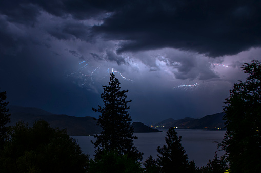 PEACHLAND, BC - AUGUST 12: A thunderstorm passes through the Okanagan valley causing sheet and fork lightning with heavy rain over Lake Okanagan in Peachland, BC Canada. (Photo by Marissa Baecker/Shoot the Breeze)