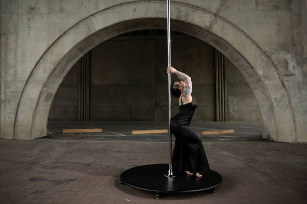 istock Caucasian middle aged female pole dancer outside 1416053253